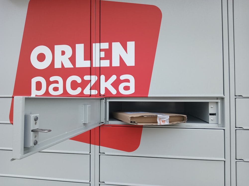 a red and white sign that says open packa