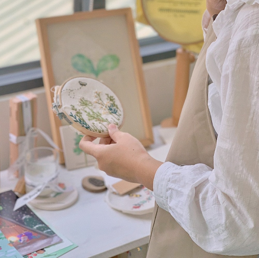 a woman is holding a plate in her hand