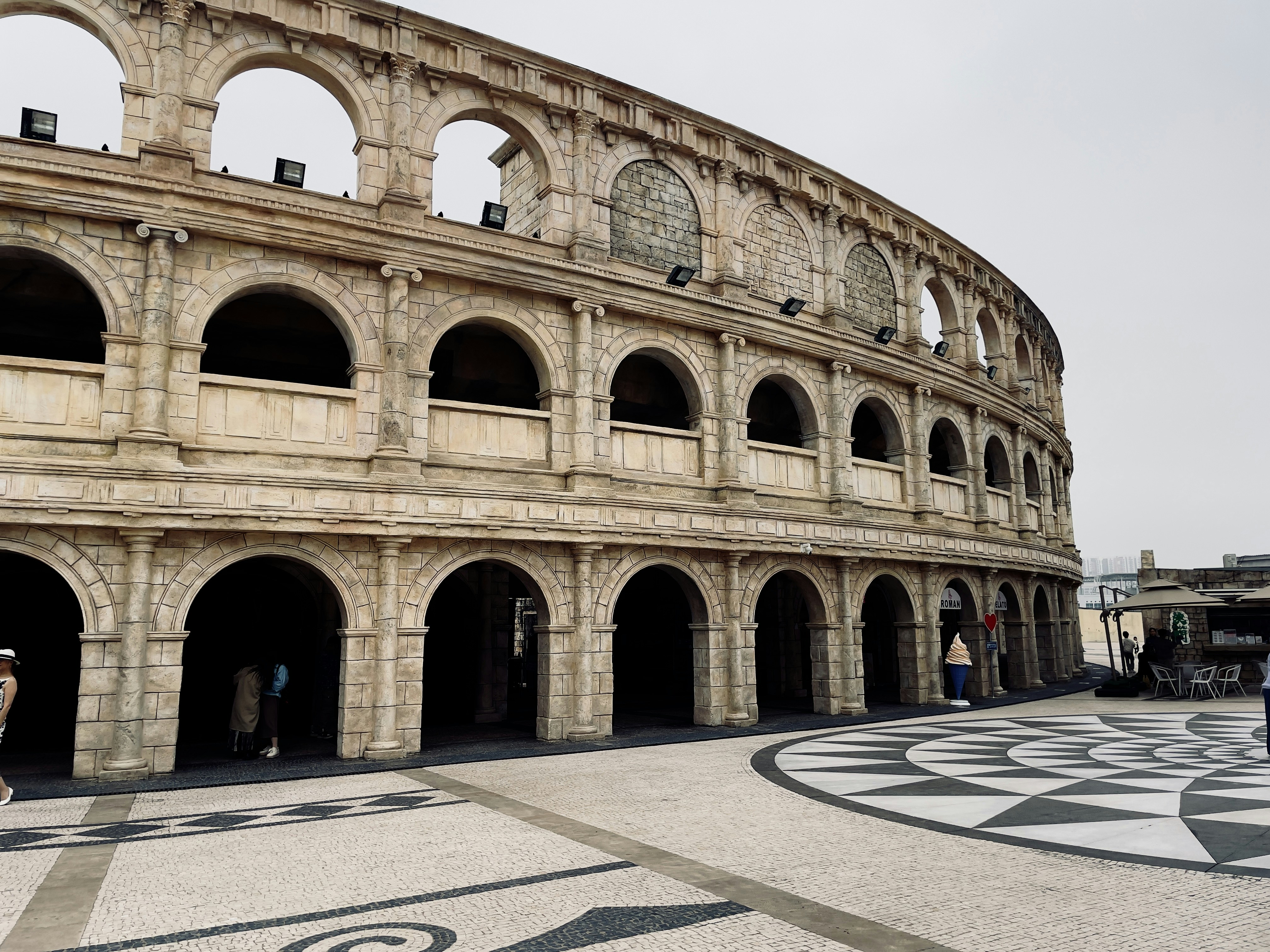 a large stone building with arches and arches around it