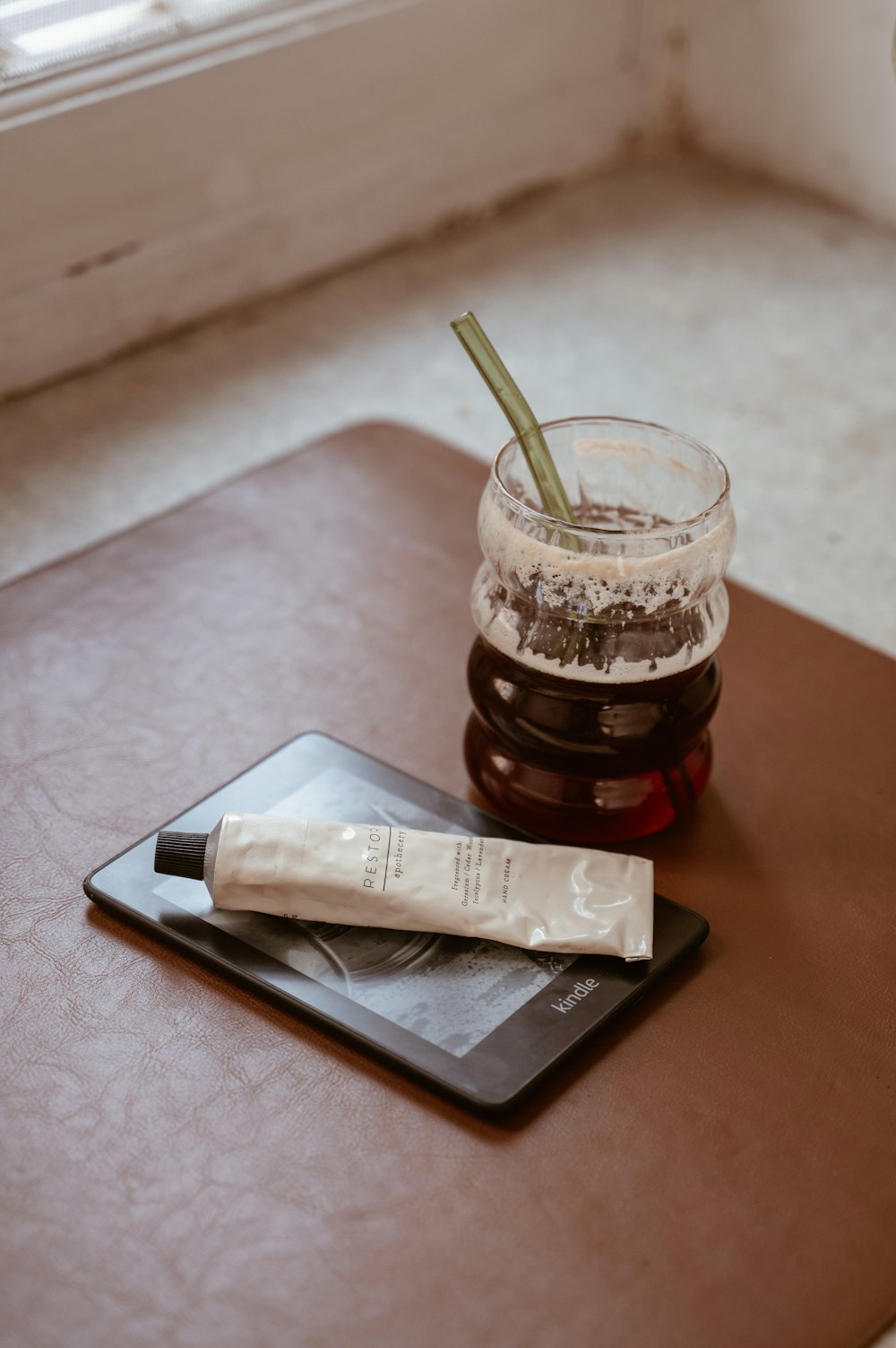 a jar of liquid sitting on top of a table