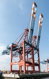 a large crane sitting on top of a wooden dock