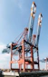 a large crane sitting on top of a wooden dock