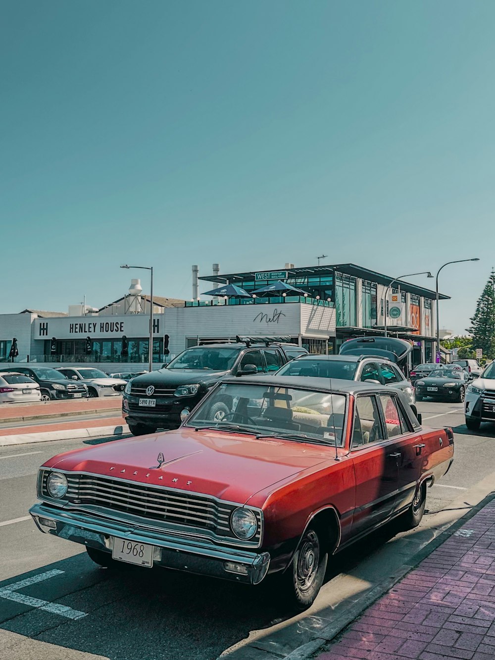 a red car parked on the side of the road