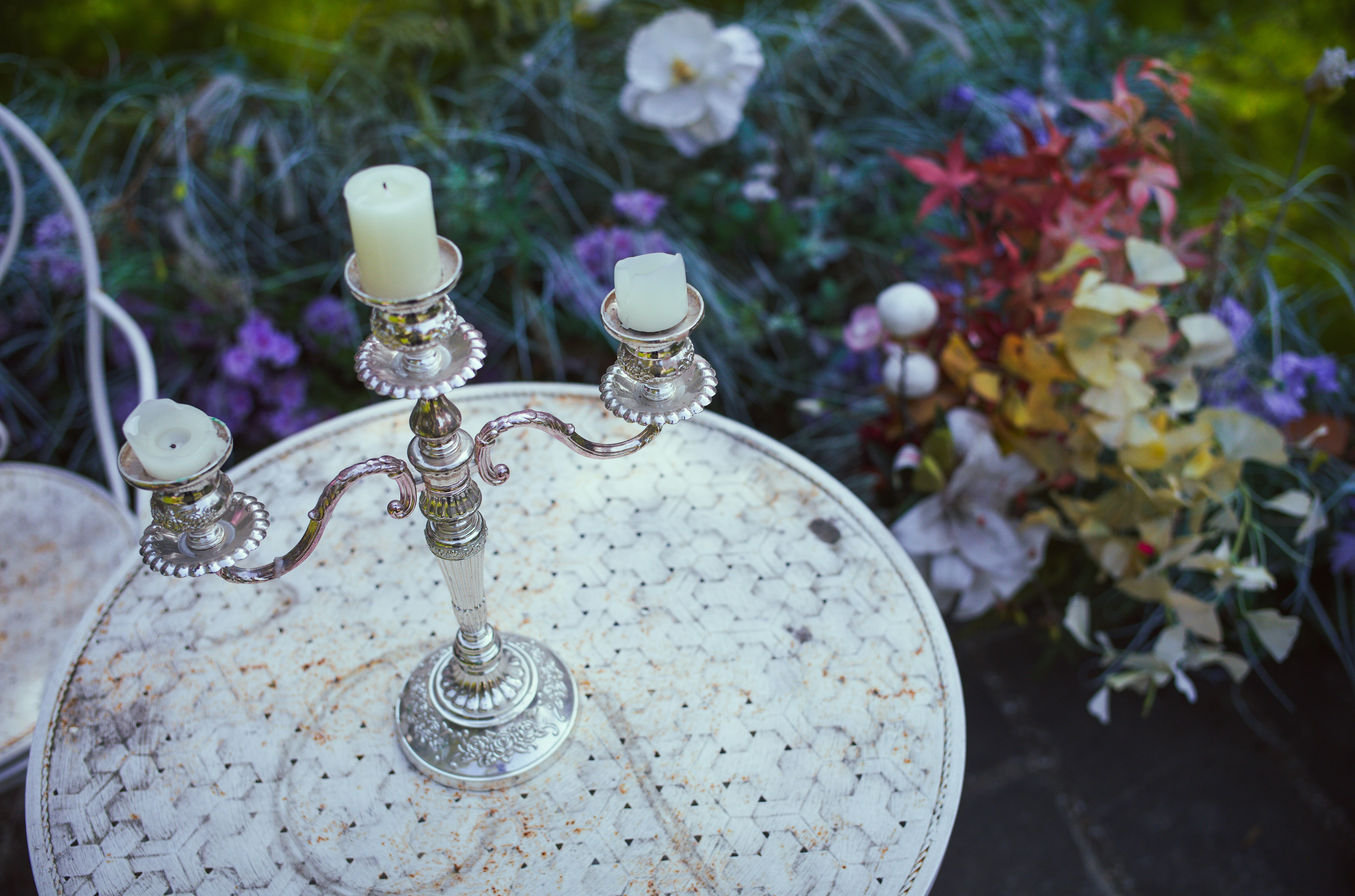 Candles on a white garden table