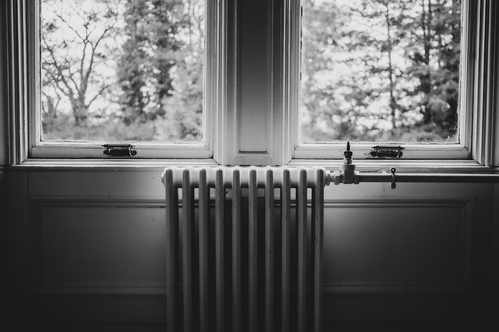 a window with a radiator and a radiator in front of it