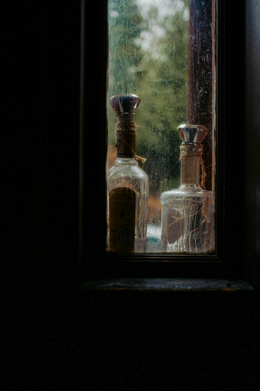 a window with a couple of bottles on it