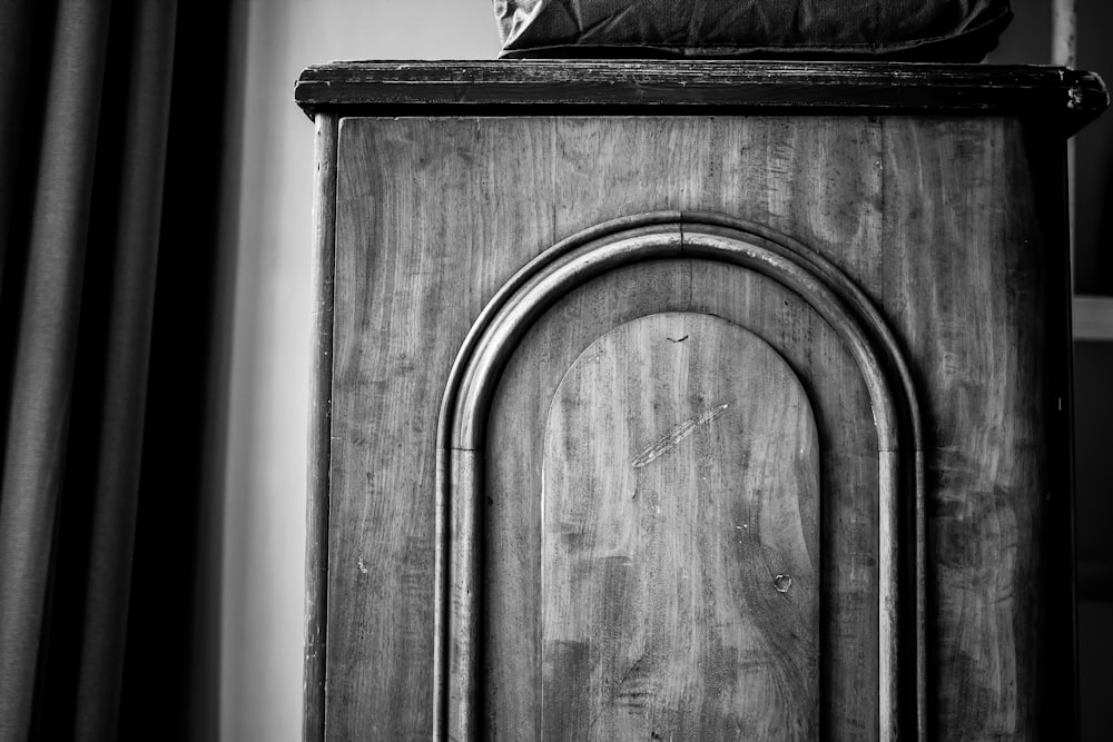 a black and white photo of a grandfather clock