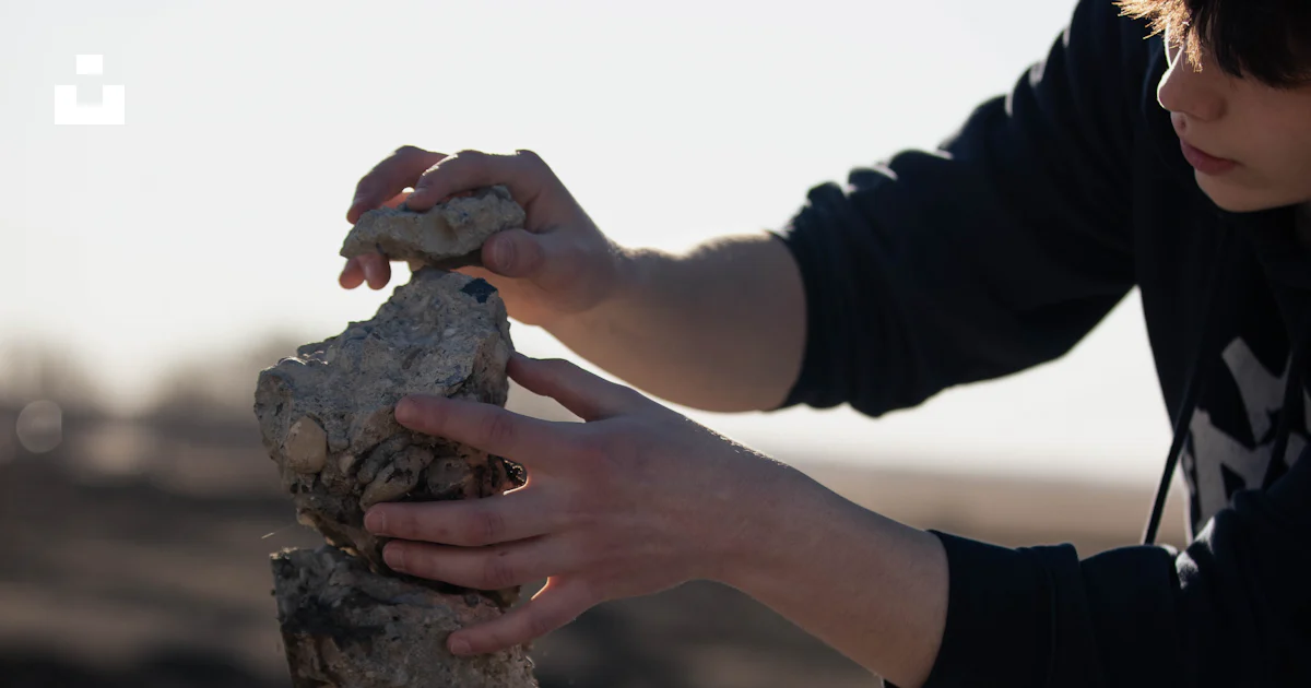 People Stacking Rocks A person stacking rocks on top of each other photo – Free Beach Image ...
