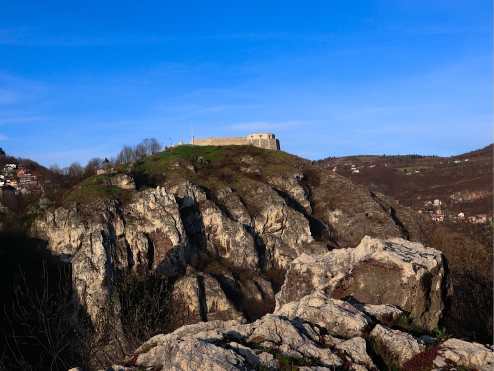 a castle on top of a rocky hill