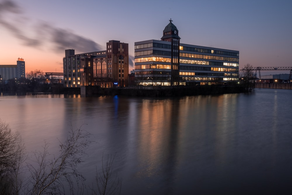 a large building sitting next to a body of water