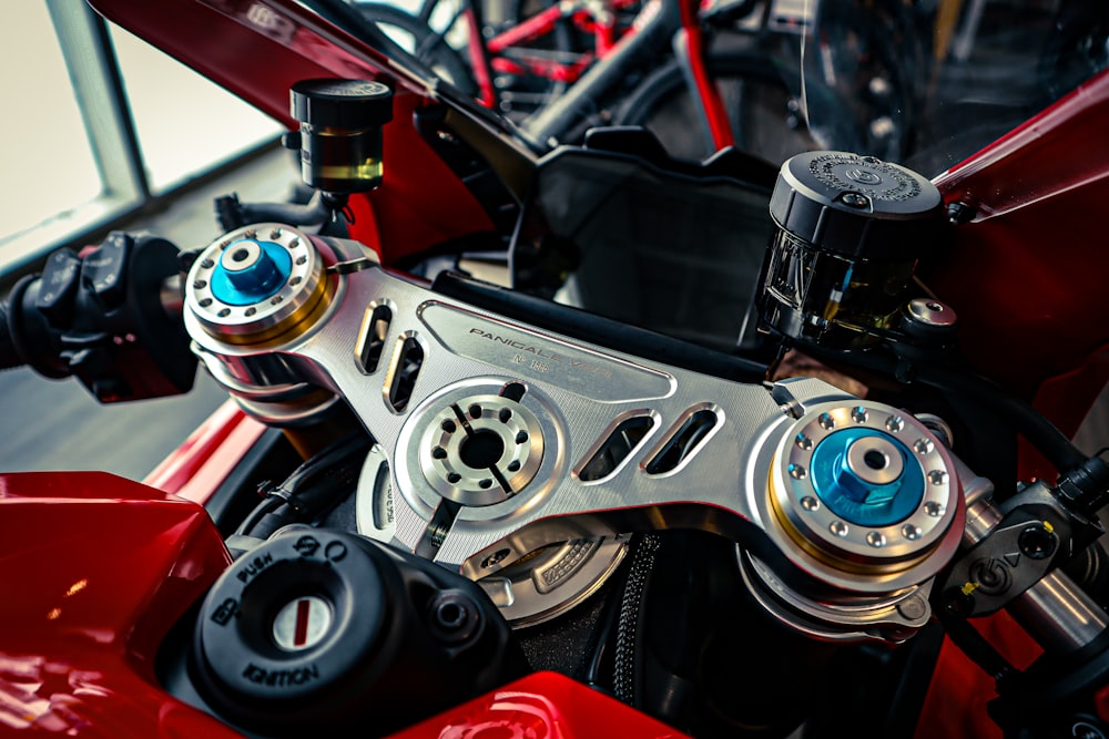 a close up of a red motorcycle engine