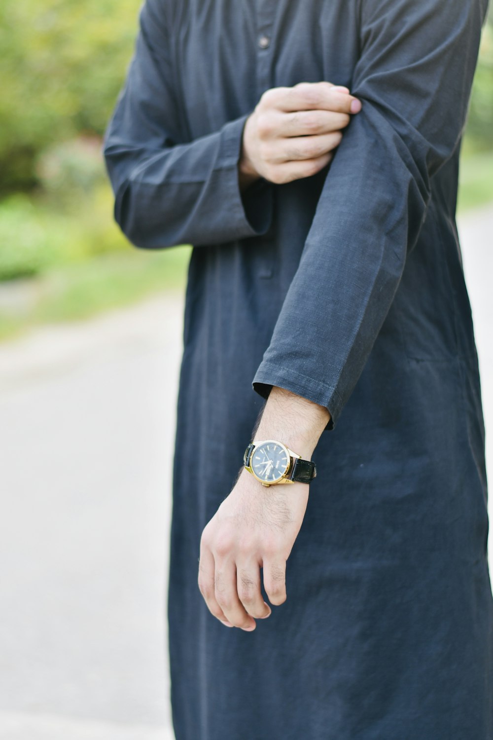 a man with a watch on his wrist