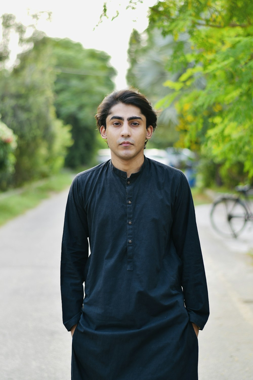 a man standing on the side of a road