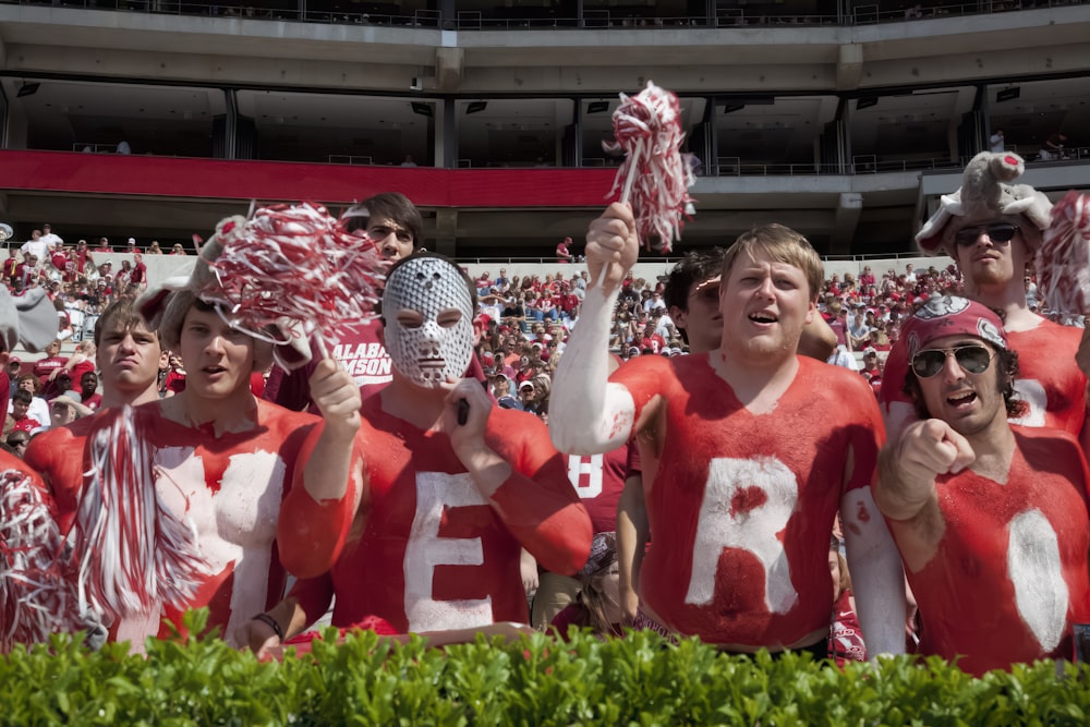 Most of the fans wear crimson and white with the name of the football team on their garments at University of Alabama, Tuscaloosa, Alabama