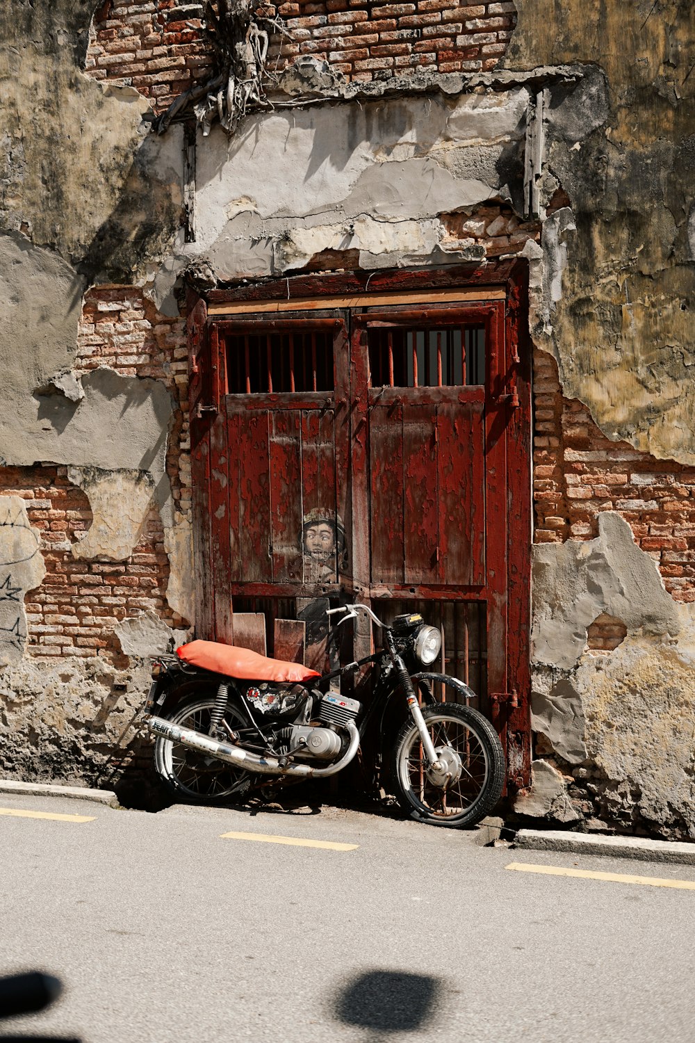 a motorcycle parked in front of an old building