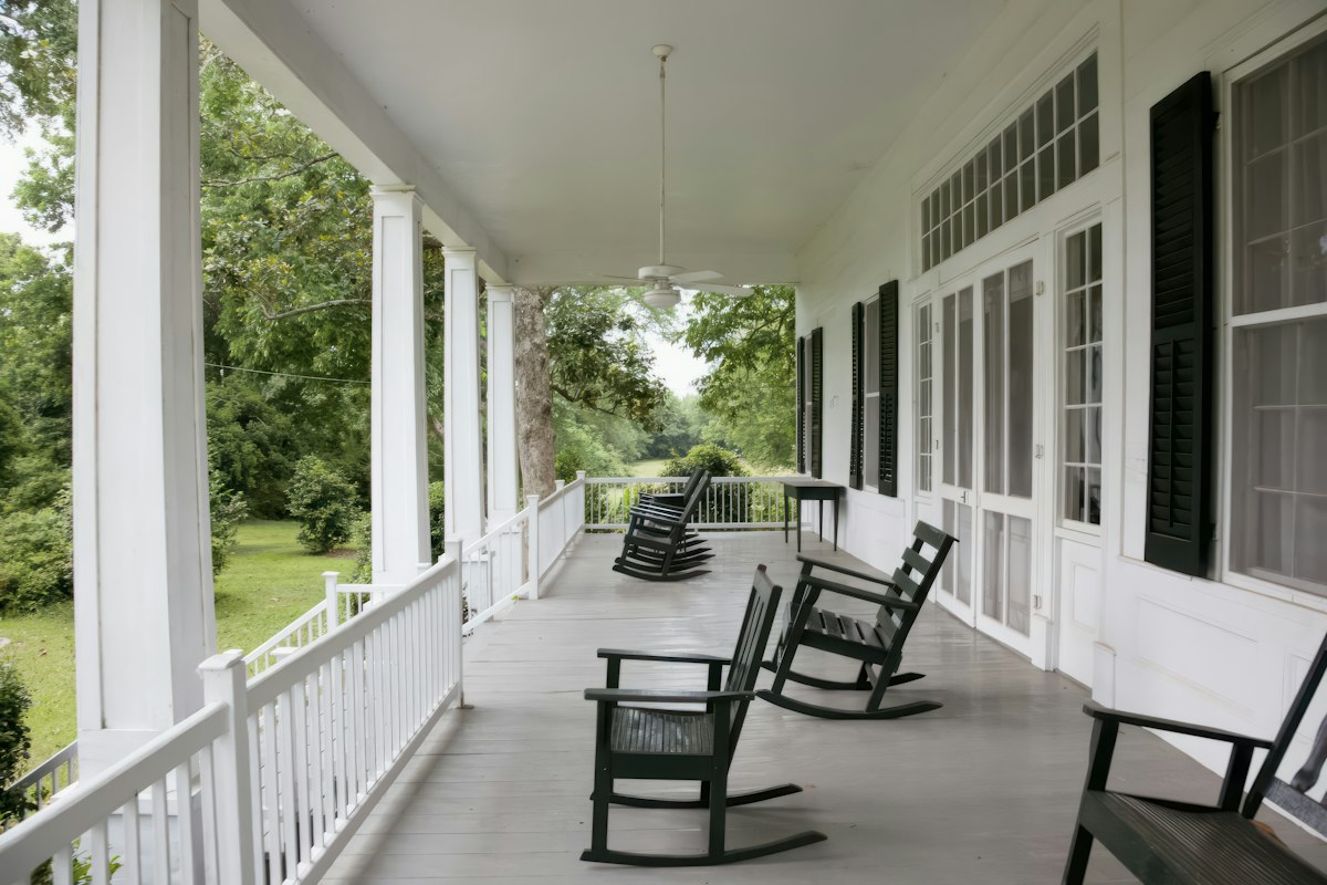 Long Carolina porch with rocking chairs on a James Island home
