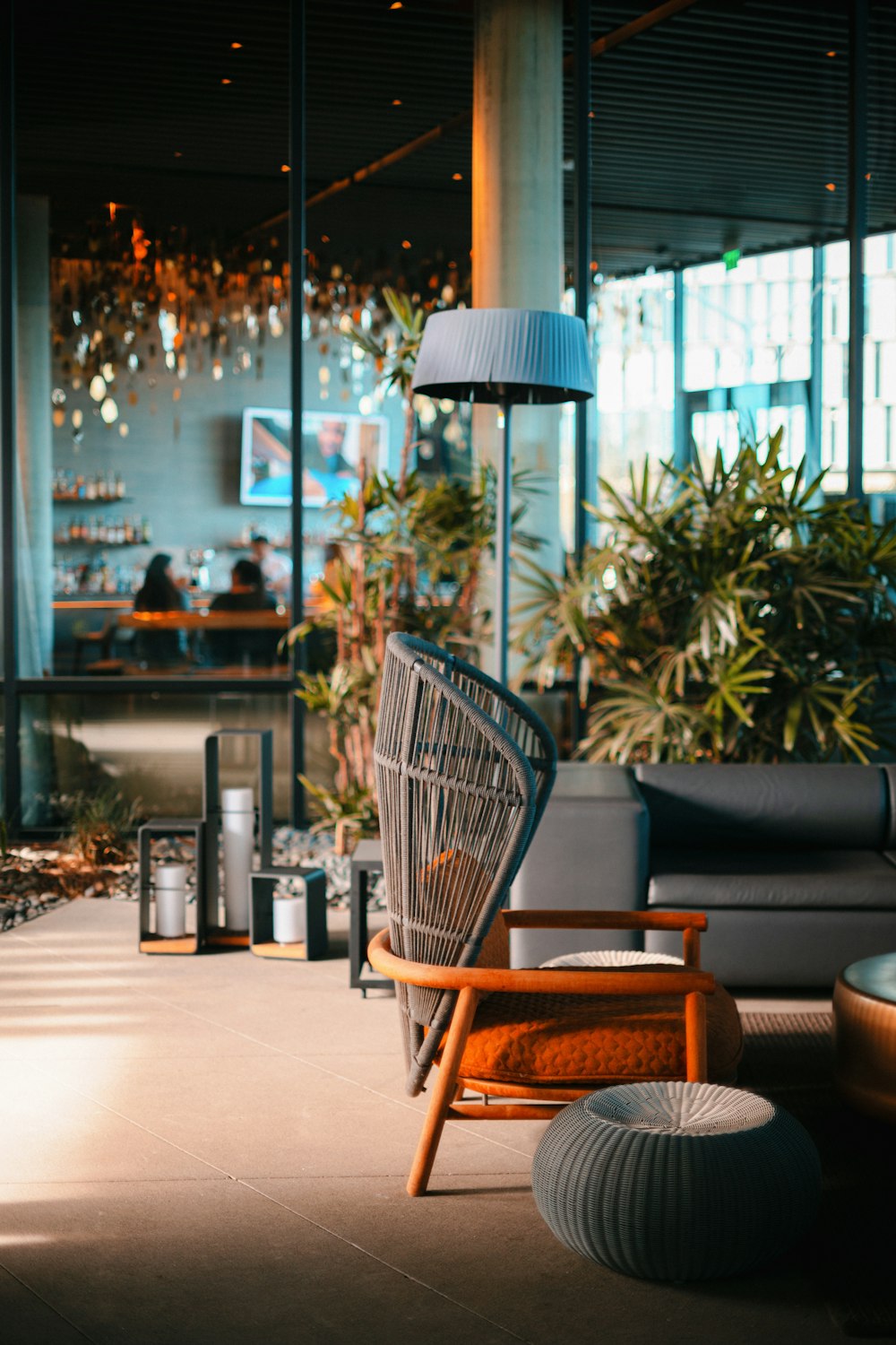 a living room filled with furniture and plants