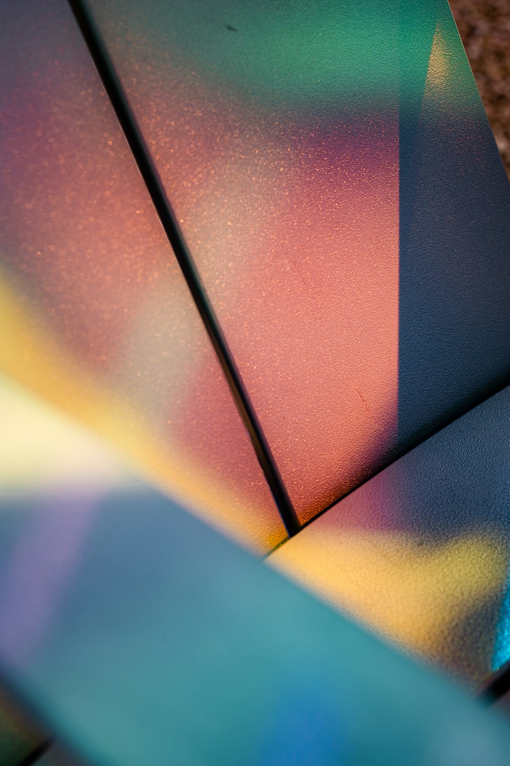a close up of a rainbow colored umbrella