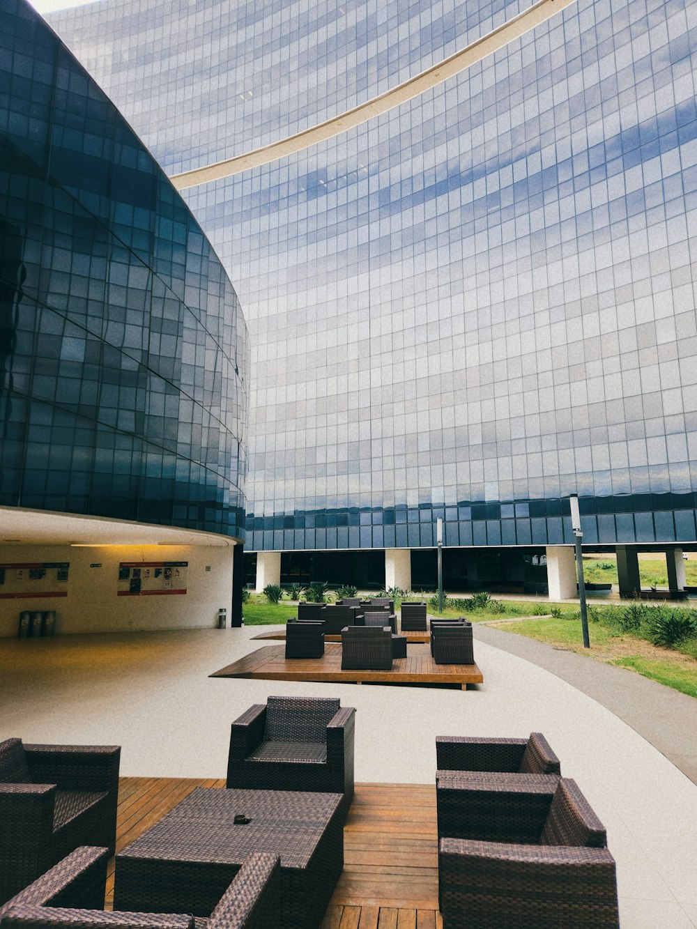 a building with a lot of chairs and tables in front of it