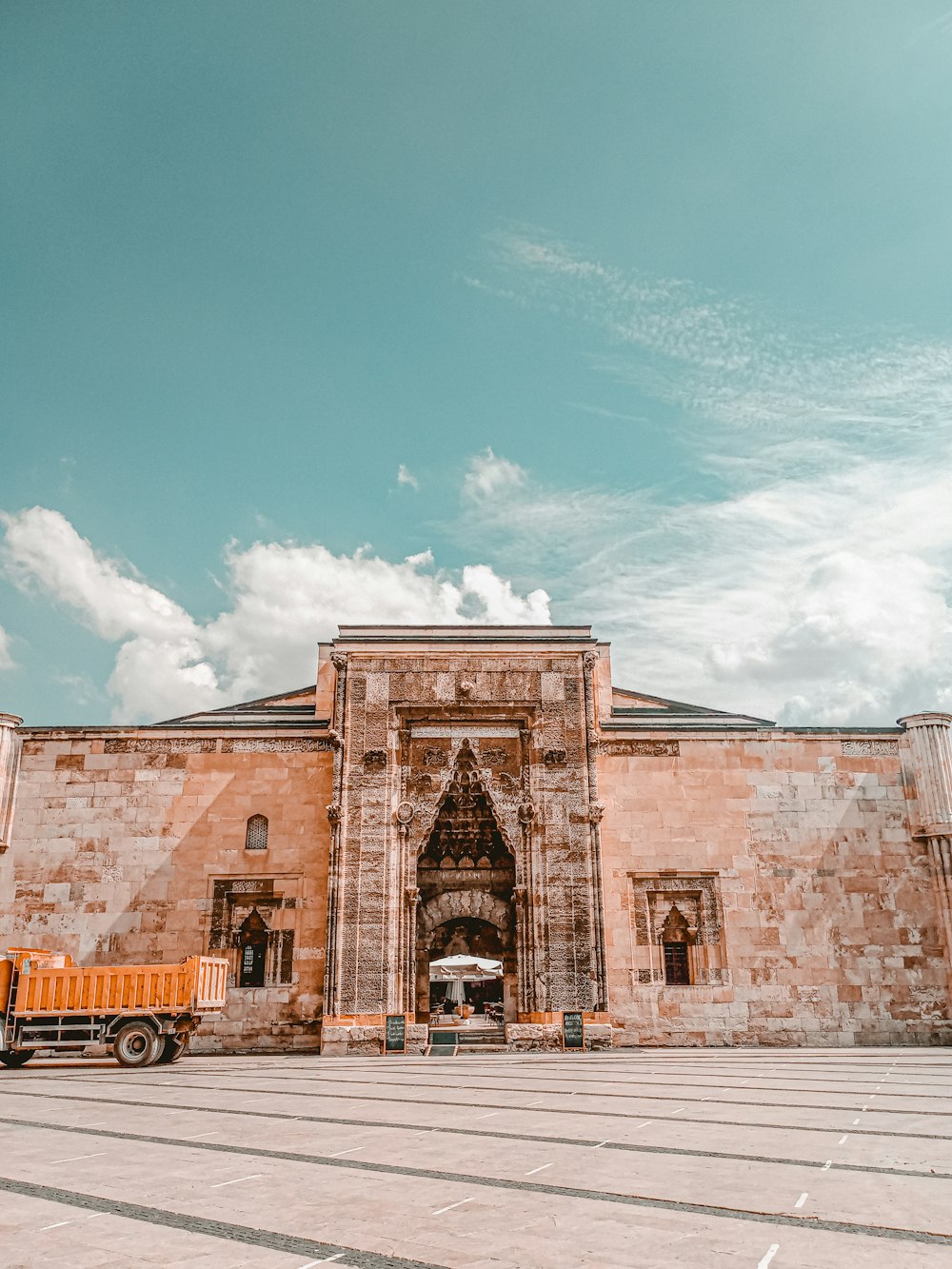 a truck is parked in front of a building