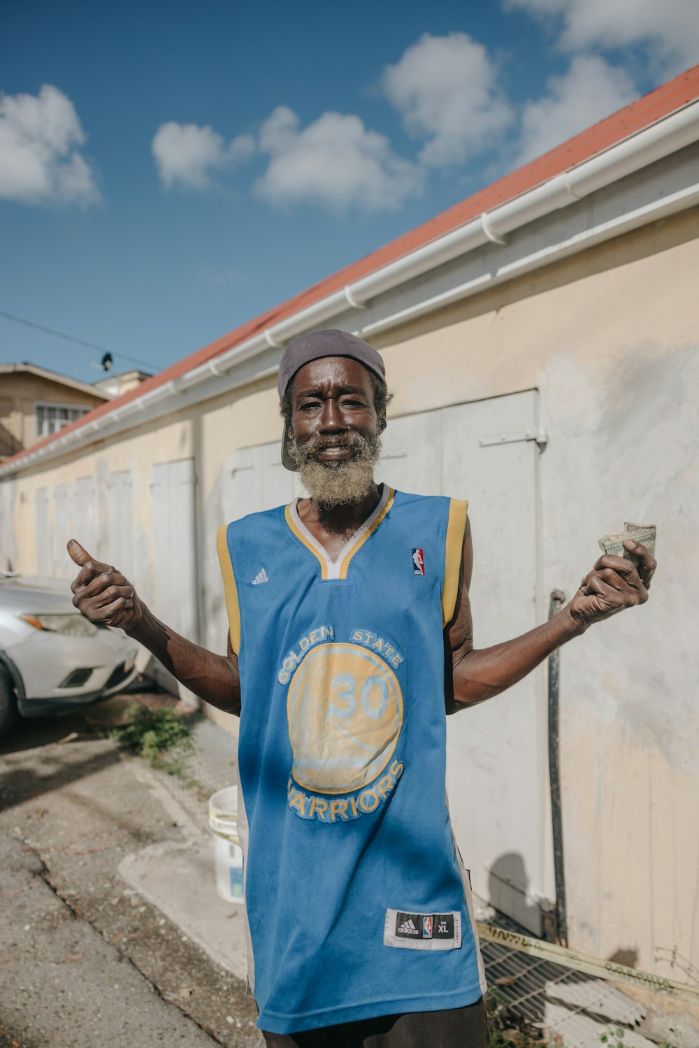 a man with a beard and a basketball jersey