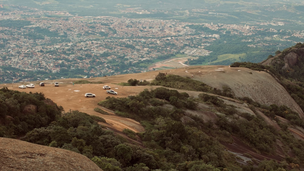 a group of cars parked on top of a hill