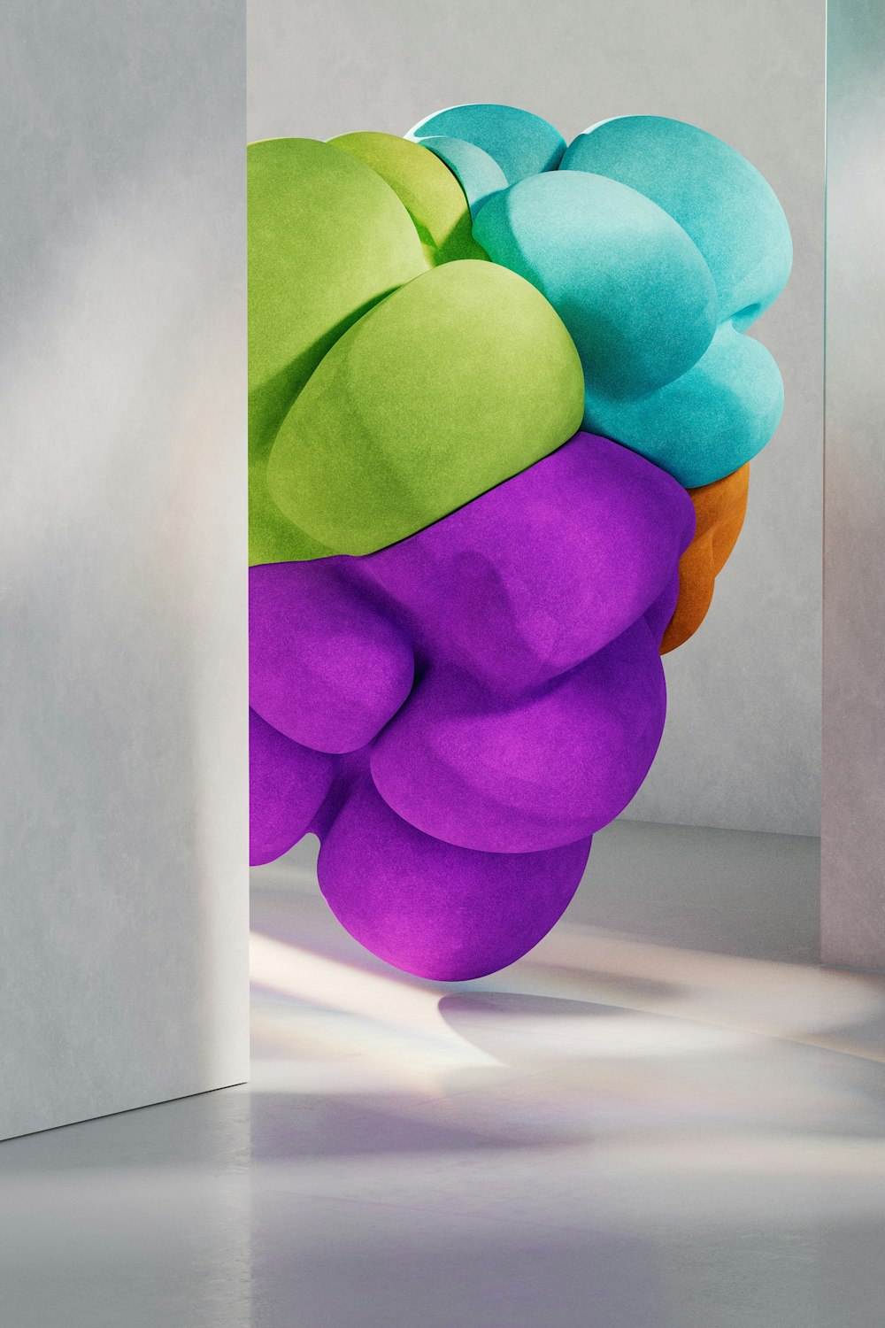 a colorful sculpture is shown in a white room