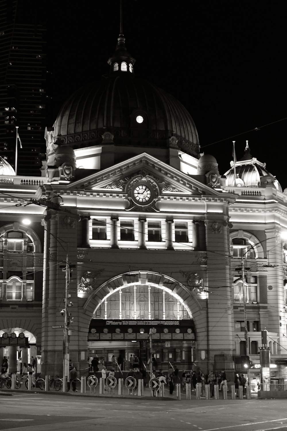 a black and white photo of a building at night