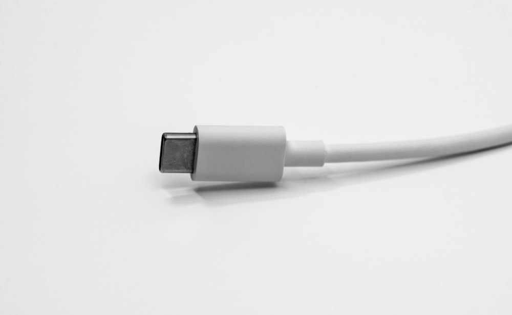 a close up of a white cable on a white surface
