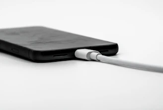 a black and white photo of a cell phone