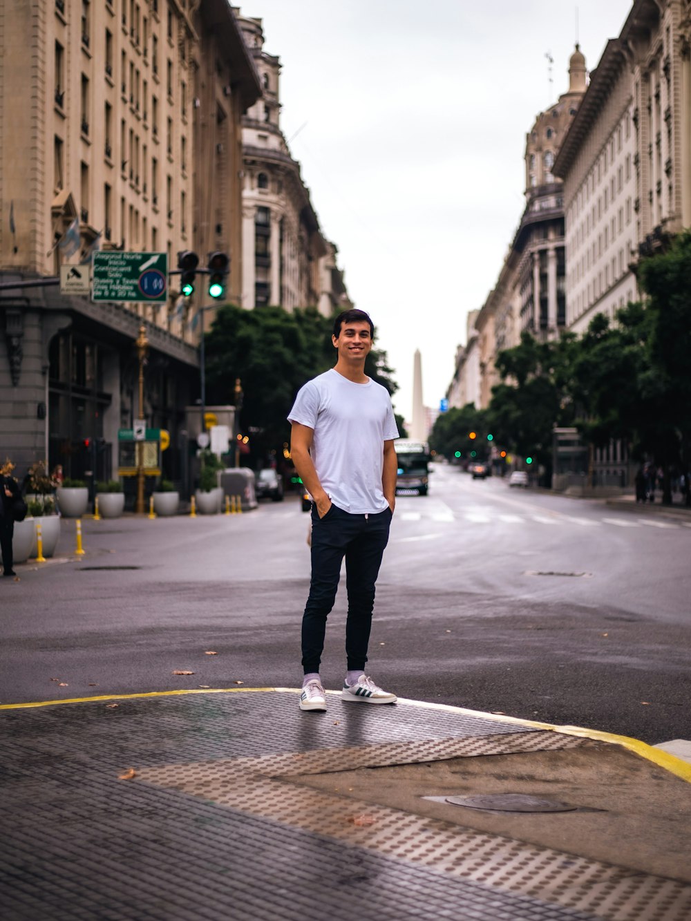 a man standing in the middle of a street