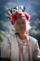 an old woman with feathers on her head