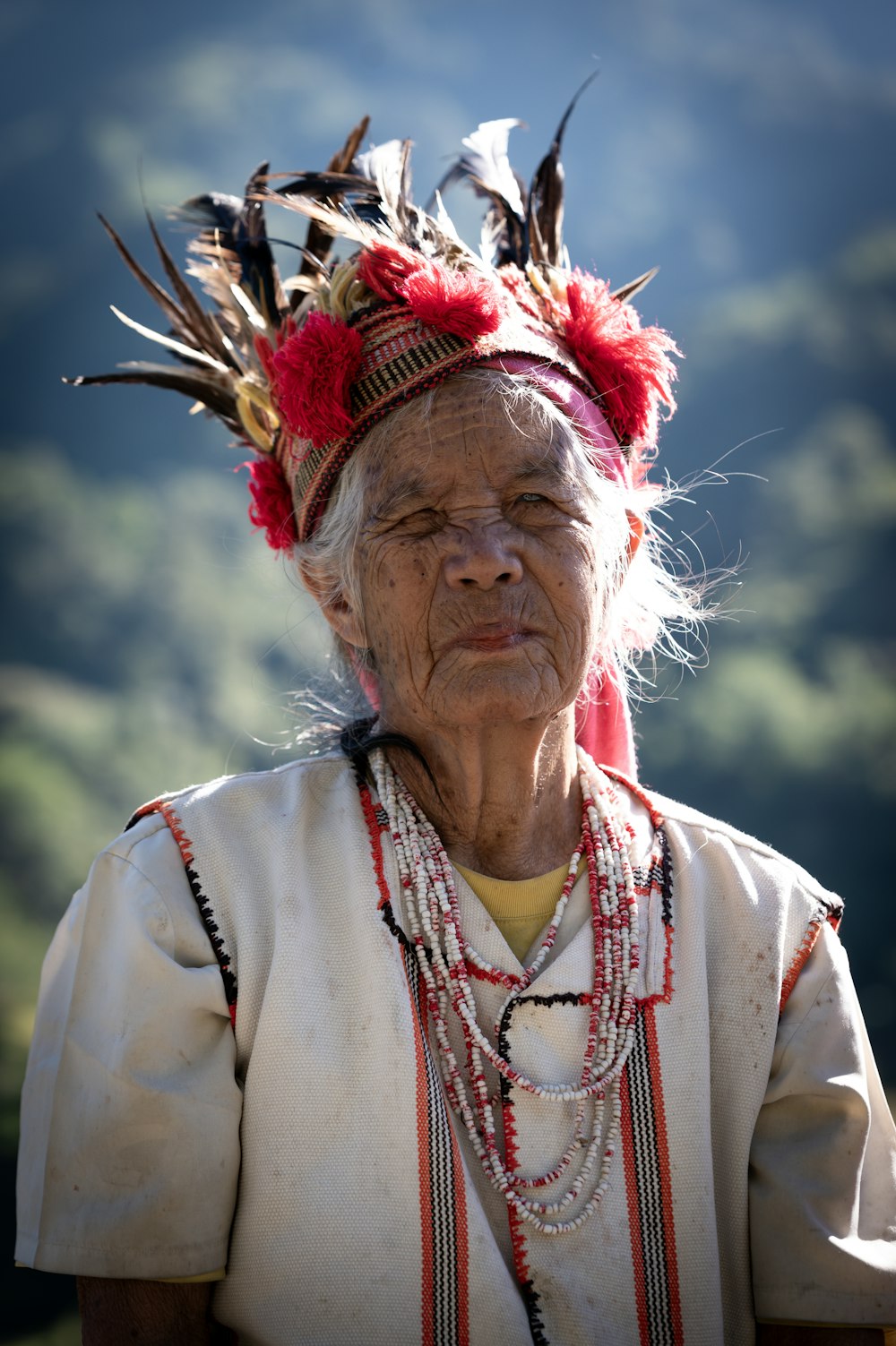 an old woman with feathers on her head