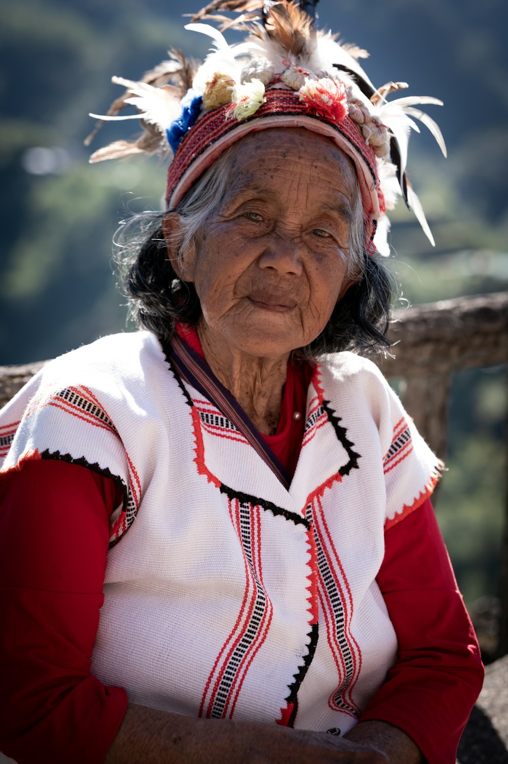 an old woman with feathers on her head