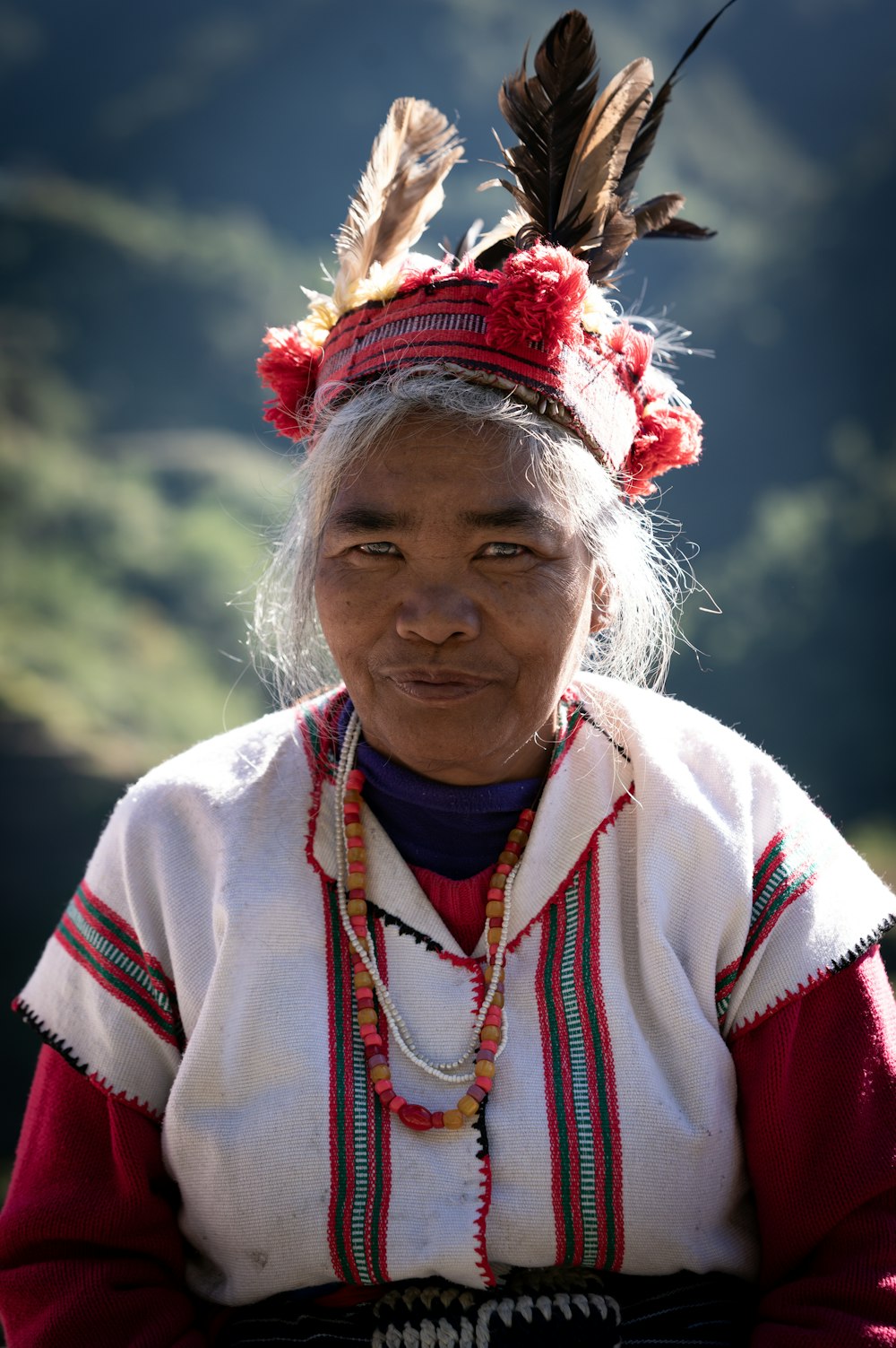 an old woman with a feather on her head