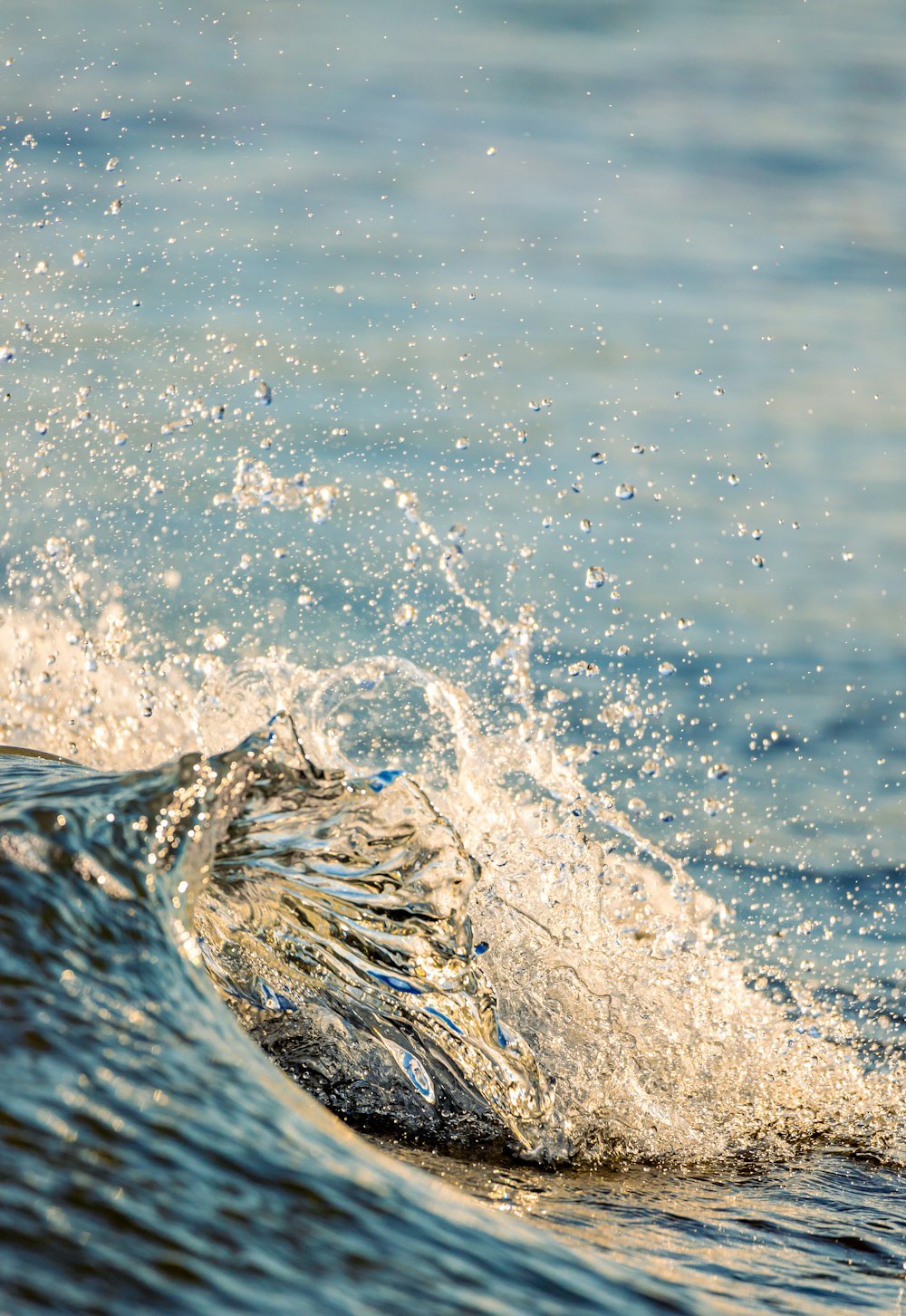 a wave is crashing into the water