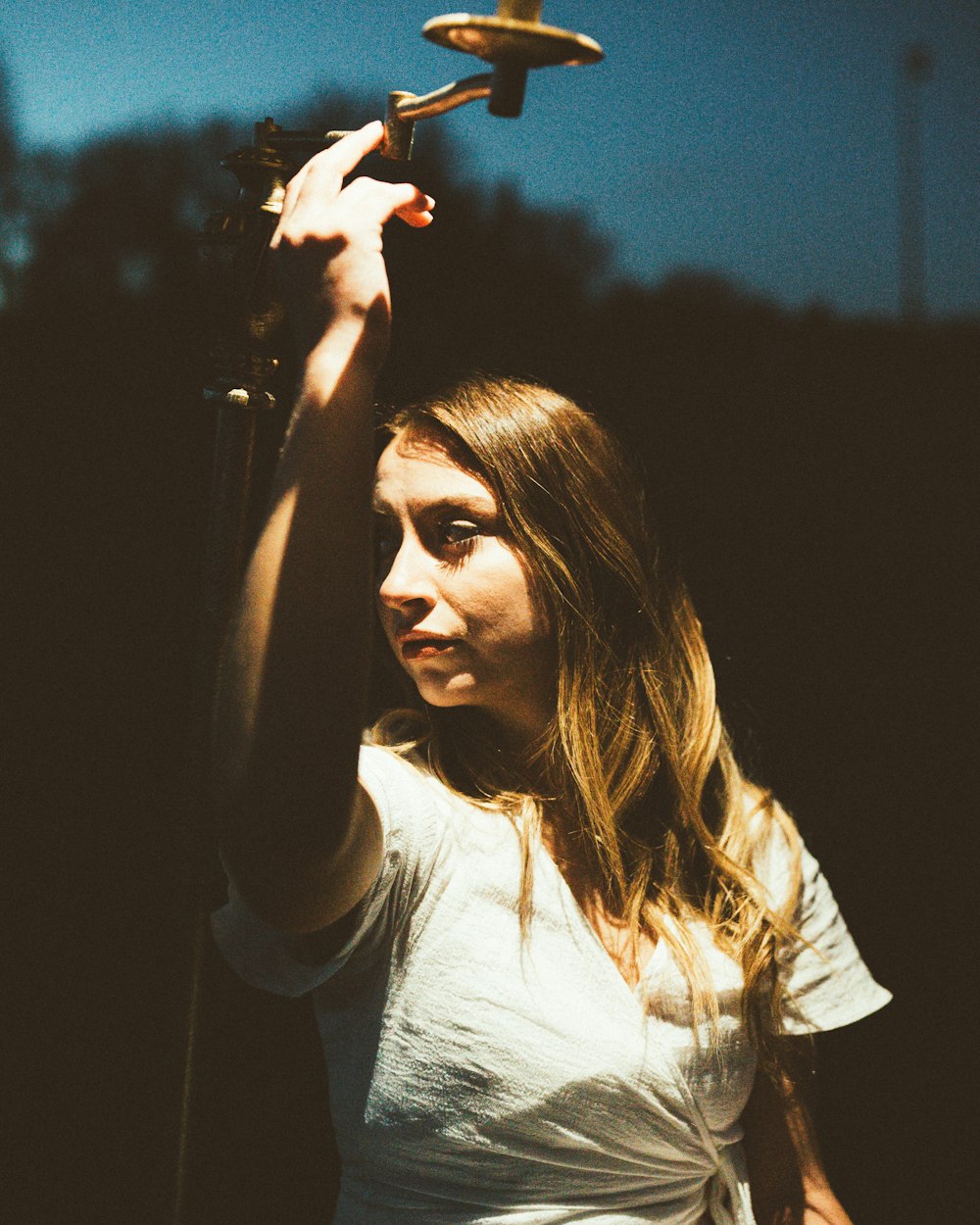 a woman holding a toy airplane in her hand