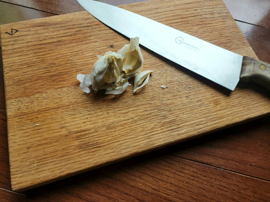 Chef's knife resting on a wooden cutting board
