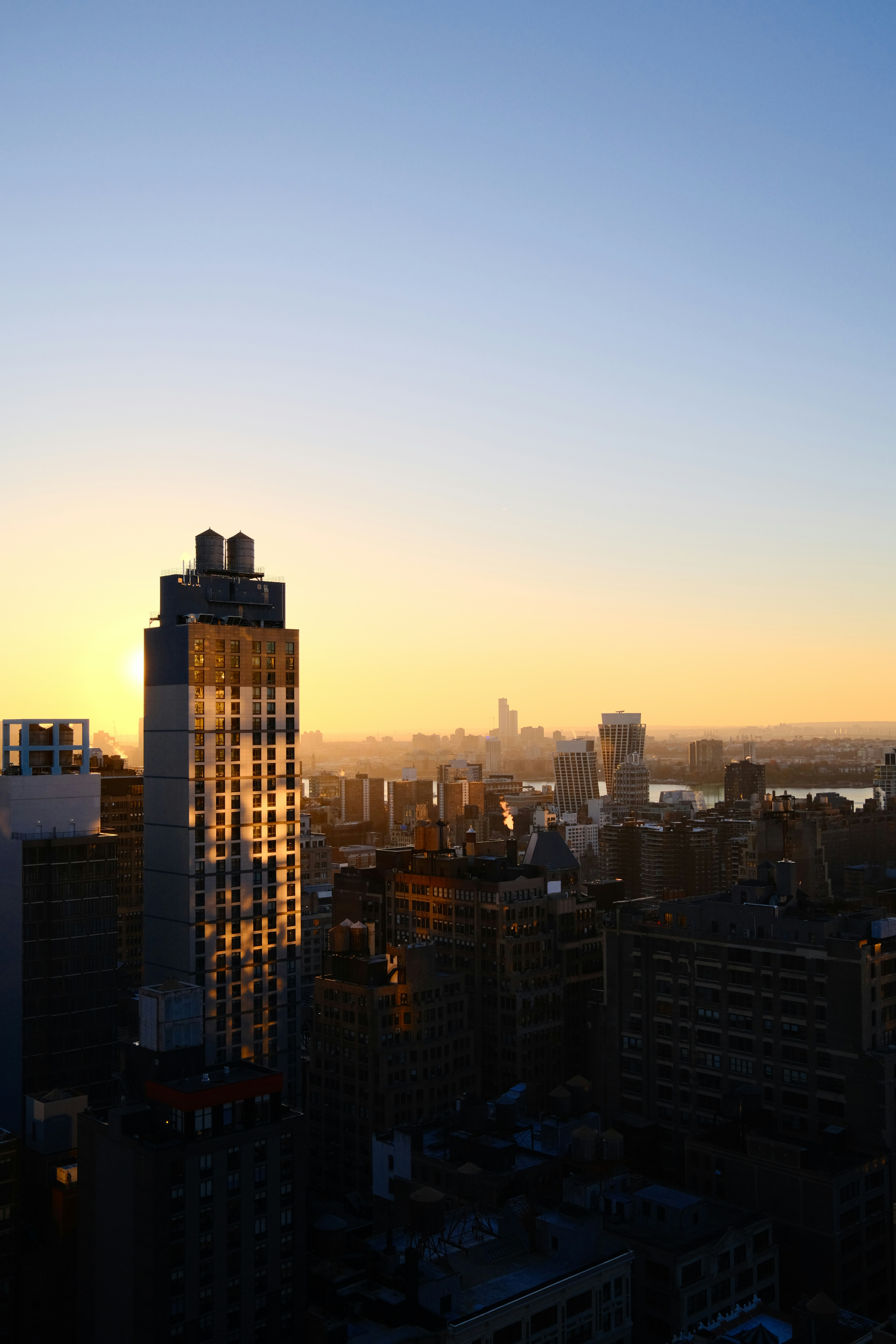 a view of a city at sunset from a high rise