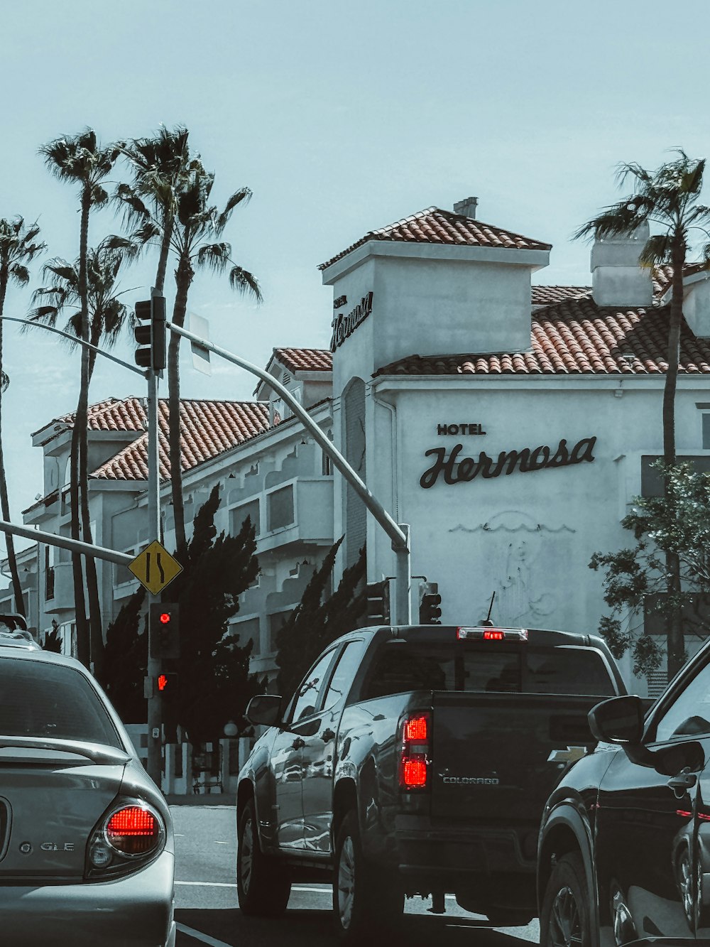 a couple of cars that are sitting in the street