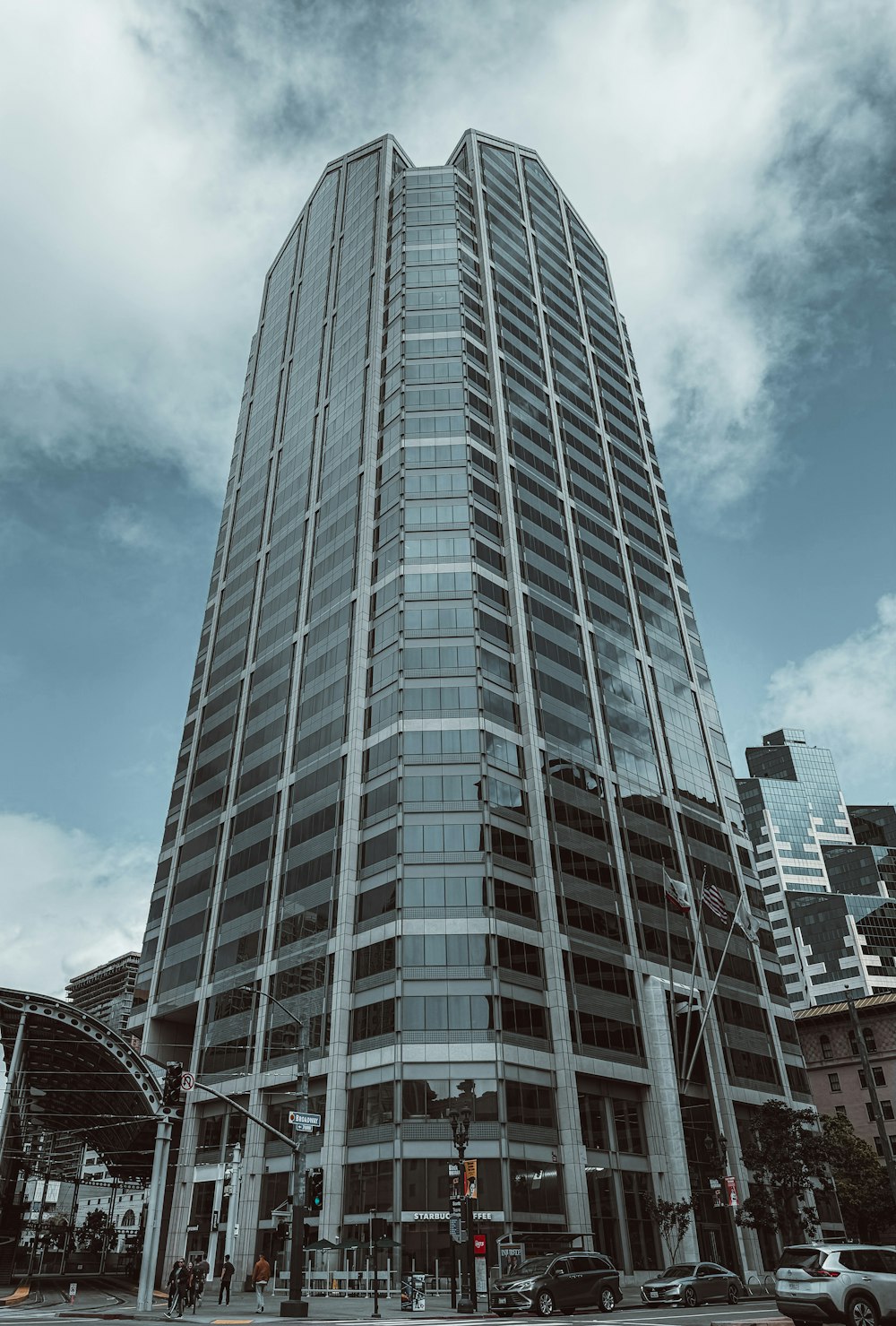 a very tall building sitting on the side of a road