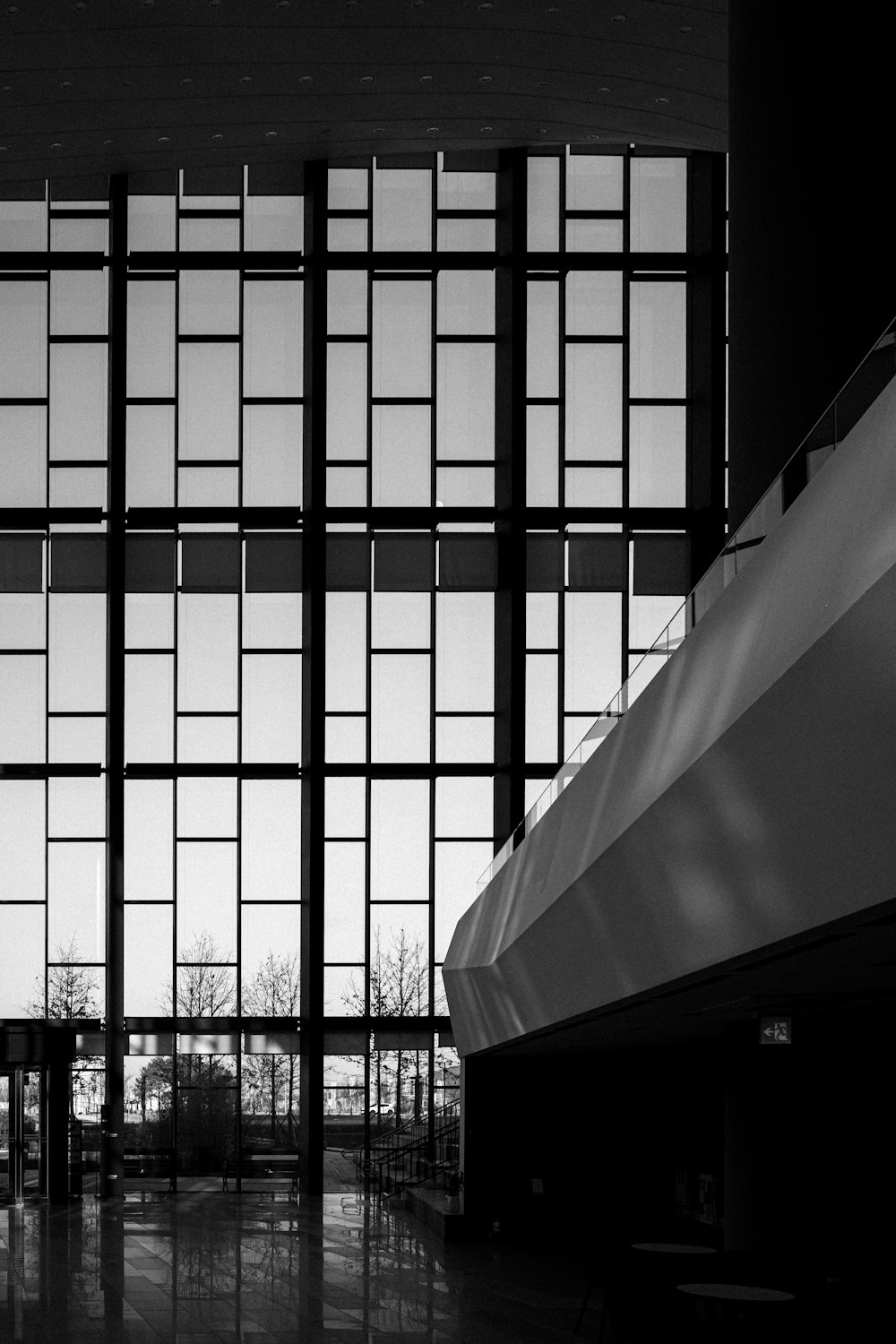 a black and white photo of a large window