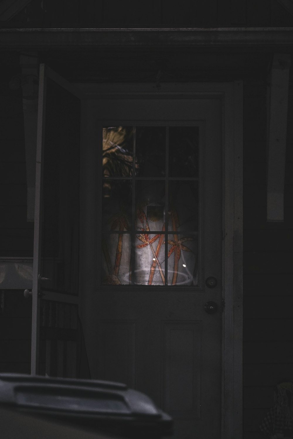 a cat sitting in the window of a house