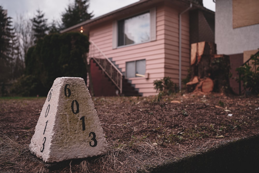 a house with a clock on the front of it