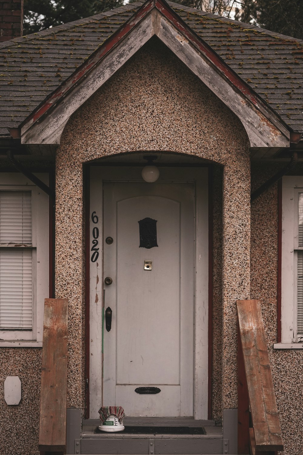 a white door sitting in front of a house
