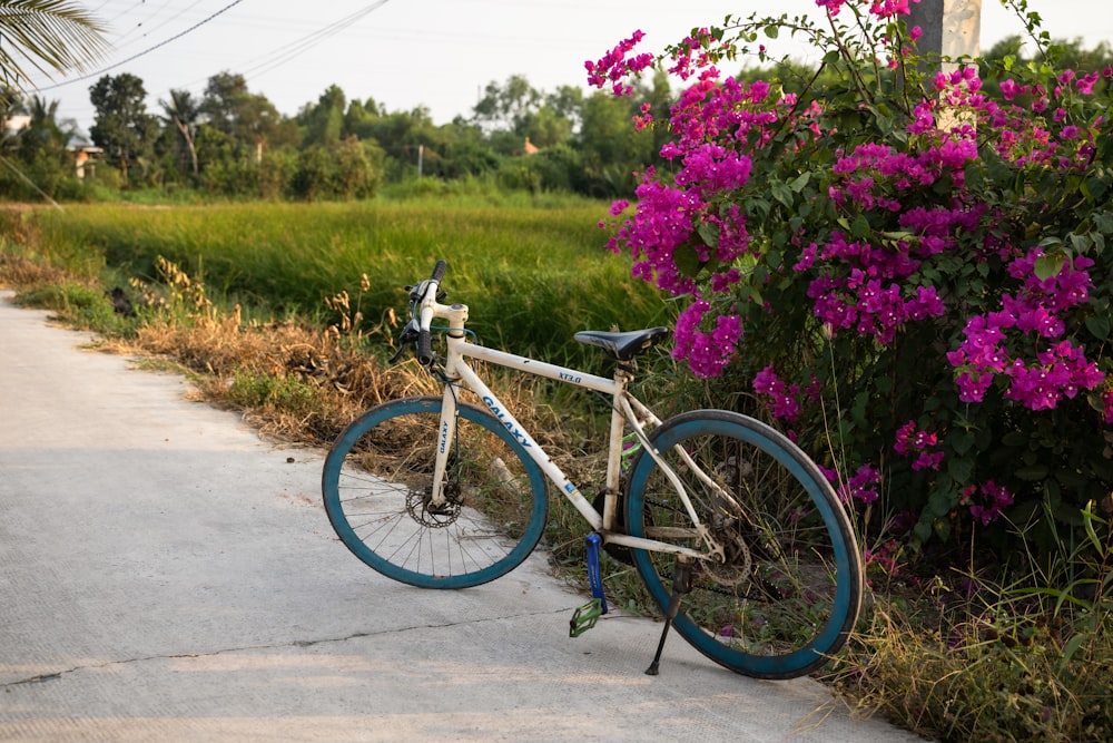 a bicycle parked on the side of a road