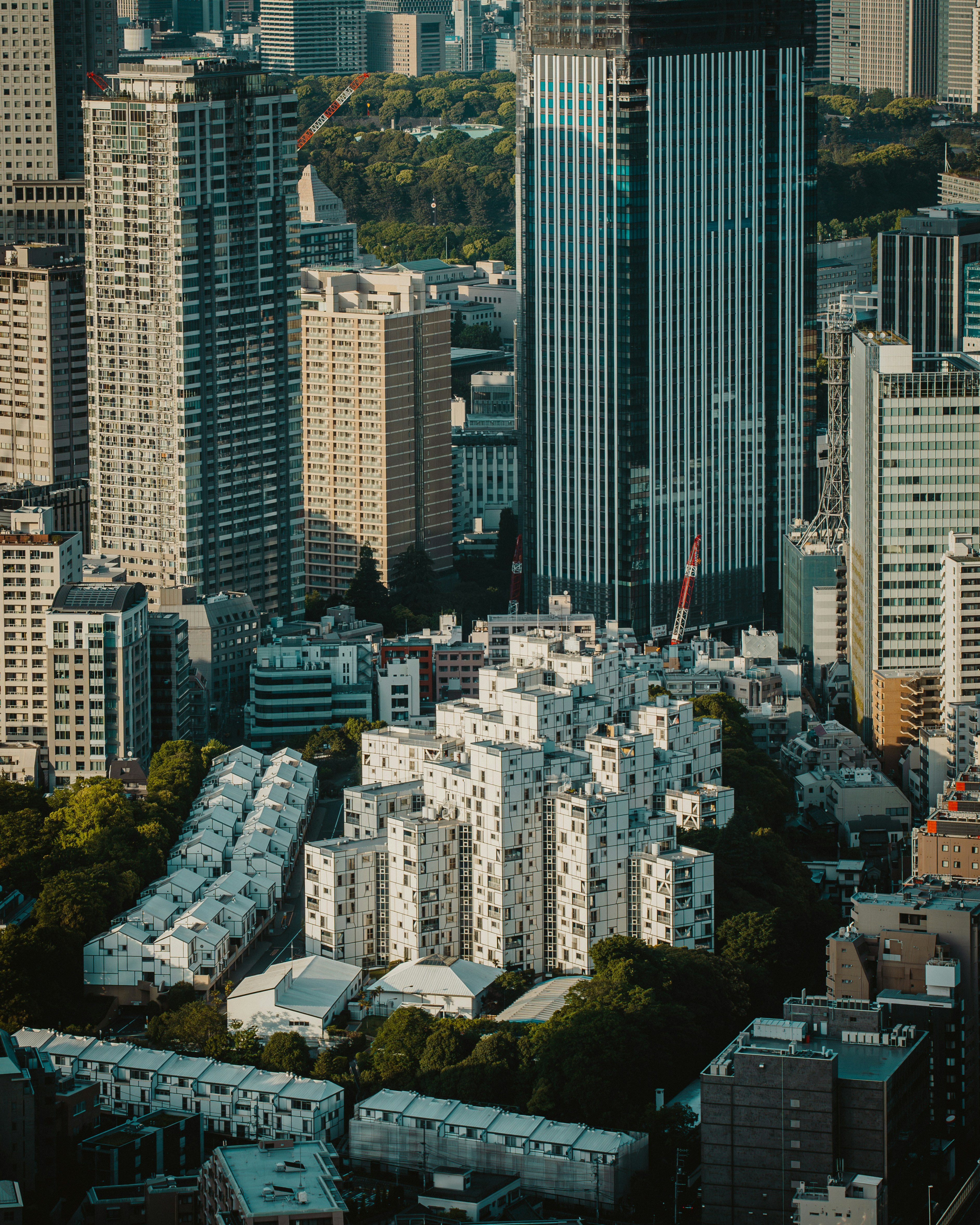 an aerial view of a city with tall buildings