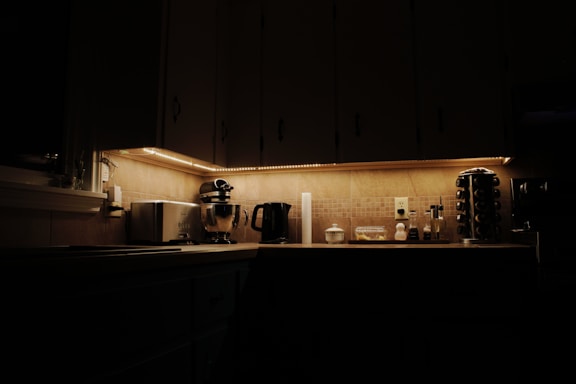 a kitchen with a microwave, coffee maker and other appliances