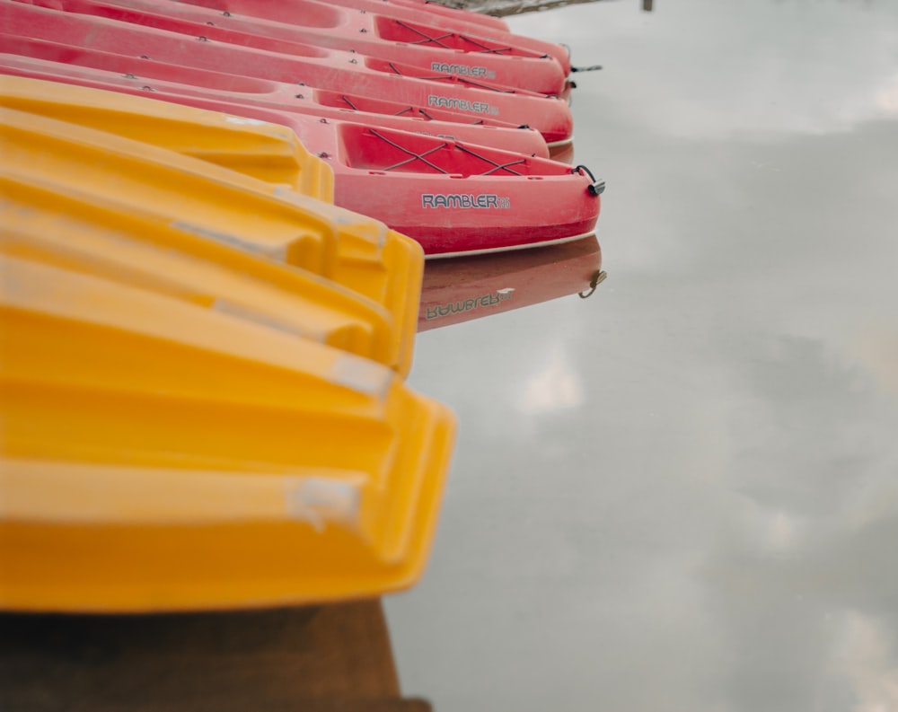 a row of canoes sitting on top of a body of water