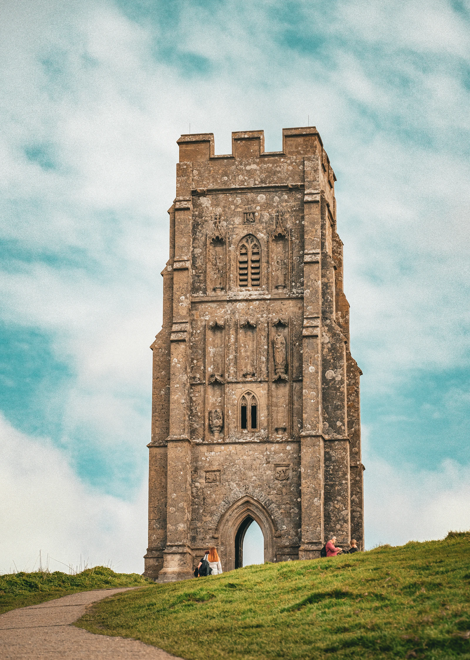 St Michael's tower on top of Glastonbury Tor above green slopes